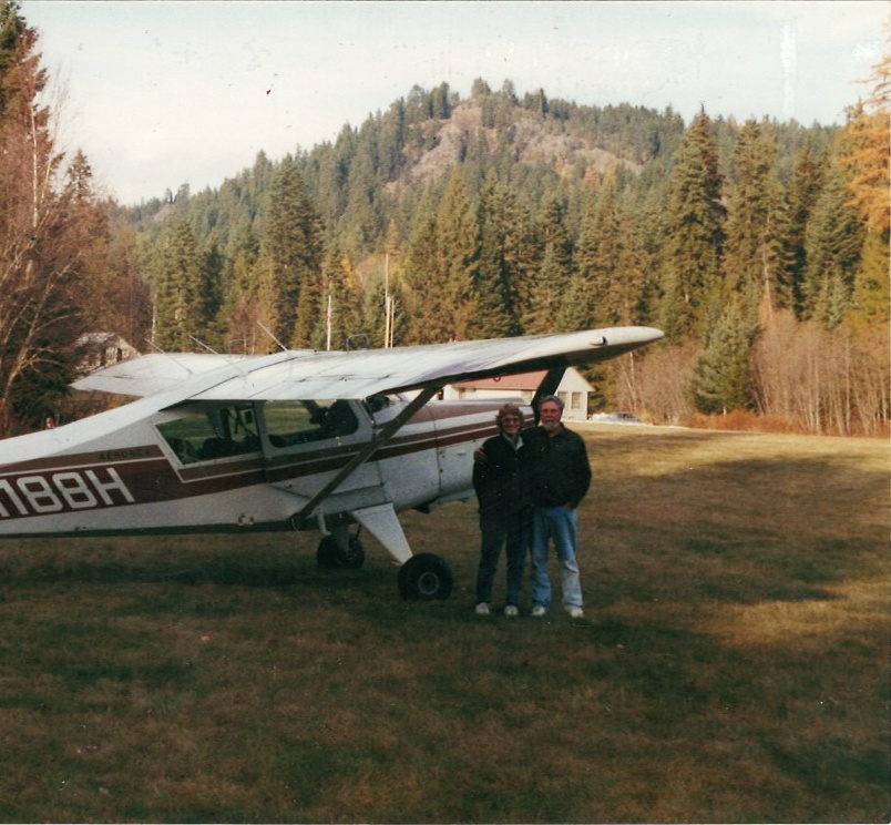 Marty and Linda Eaton standing beside an airplane